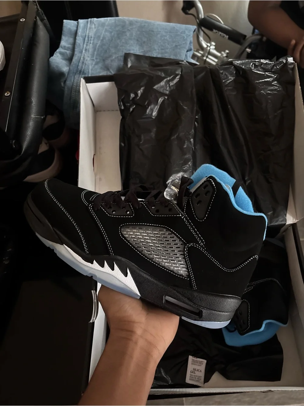 Air Jordan 5 black and University Blue